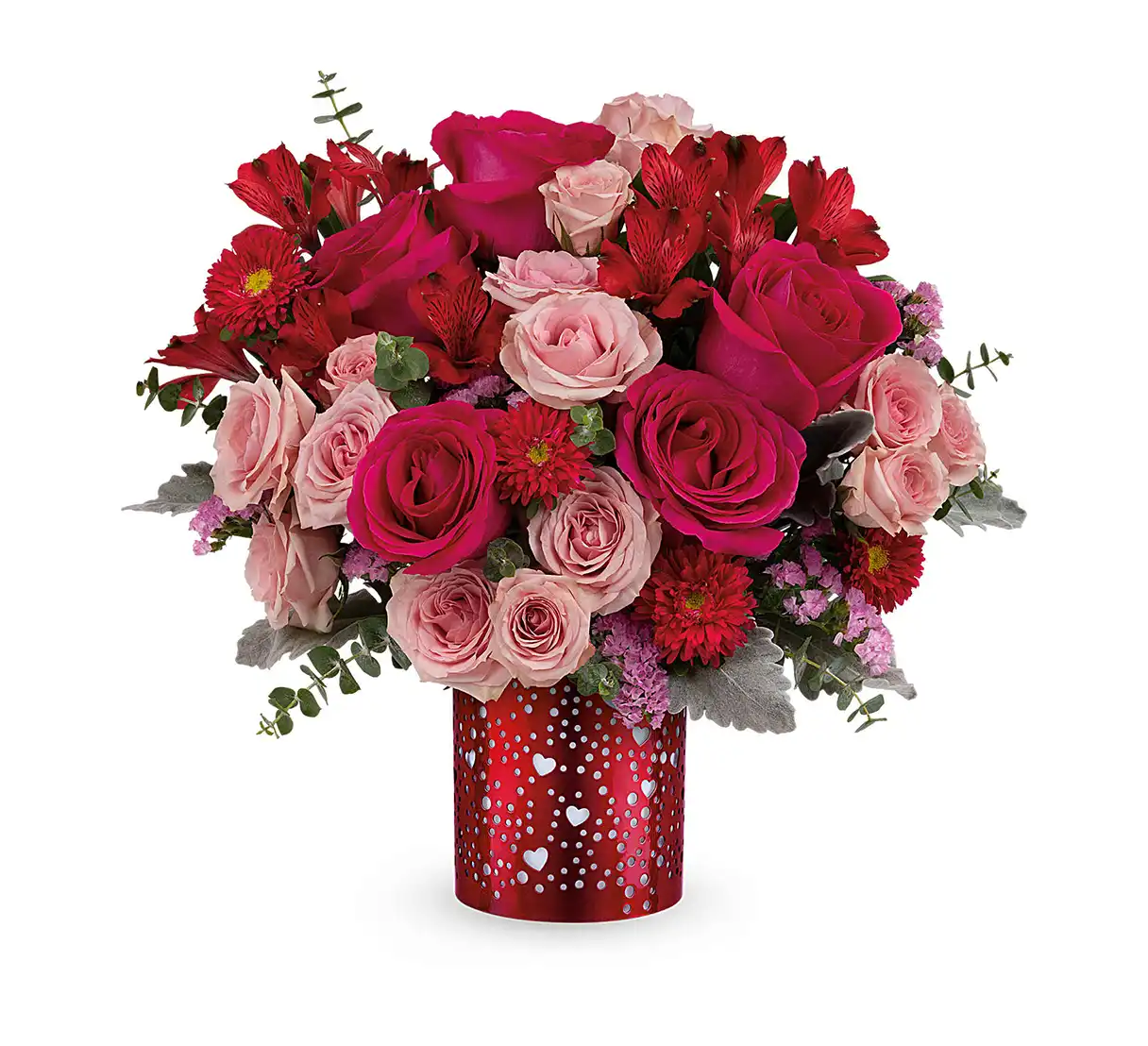 Hot pink and red flower bouquet in a red metal lantern with heart cutouts.
